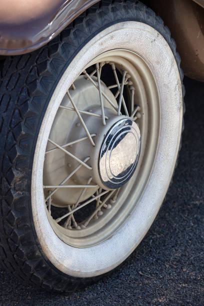 istock White walled tire on old spoked wheel 670385588