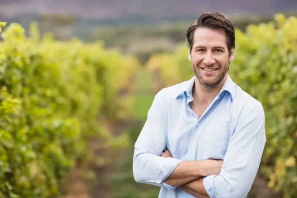 Photo of Happy vintner with crossed arms