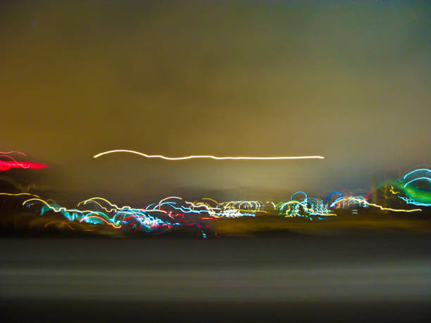 istock view by night and rain thru the front window of the car 670386484