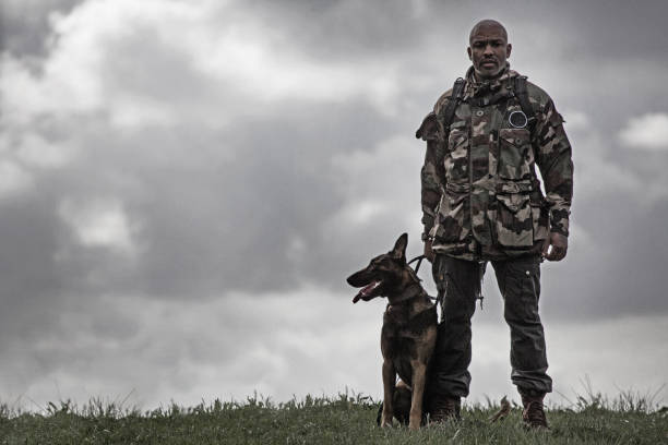 istock Silhouette of man and his dog 670387724