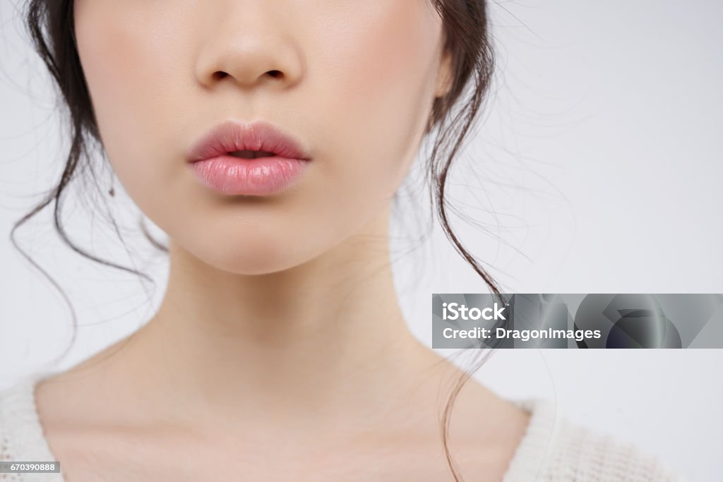 Besutiful lips Cropped image of young woman with plump lips Human Lips Stock Photo
