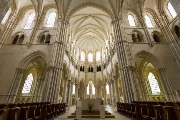 Interior of the roman cathedral St. Madeleine in Vezelay with view towards the gothic choir.