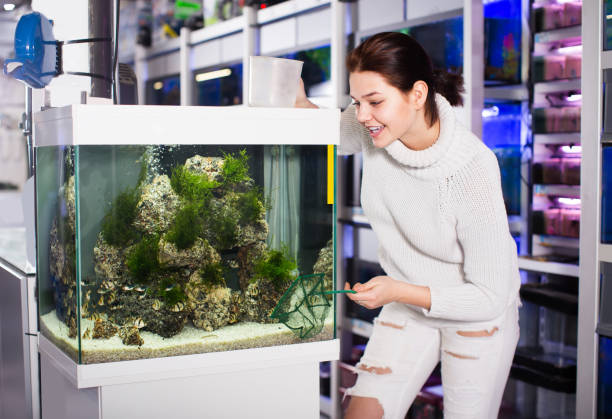 istock Girl chooses the fish that she catches 670397288