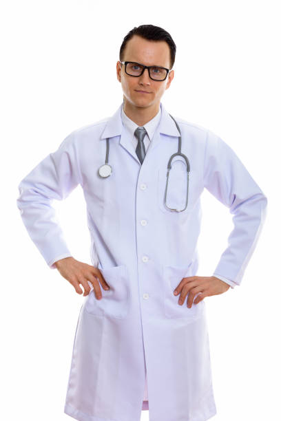 istock Studio shot of young handsome man doctor standing with hands on hips 670397760