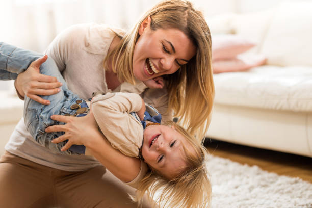 istock Playful mother and her small son having fun at home. 670400944