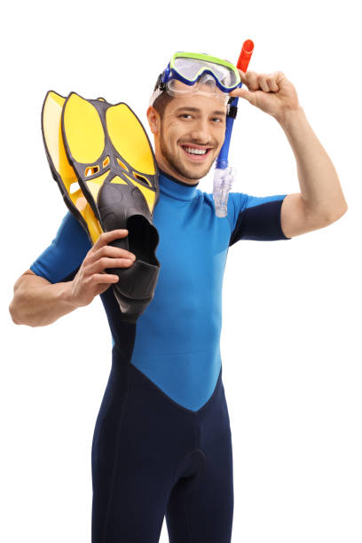 istock Young man with a wetsuit and snorkeling equipment 670401158