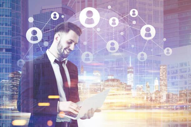 istock Bearded man with laptop in blue city, toned 670402178