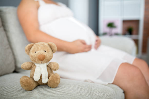 istock Woman Holding Teddy Bear 670403494