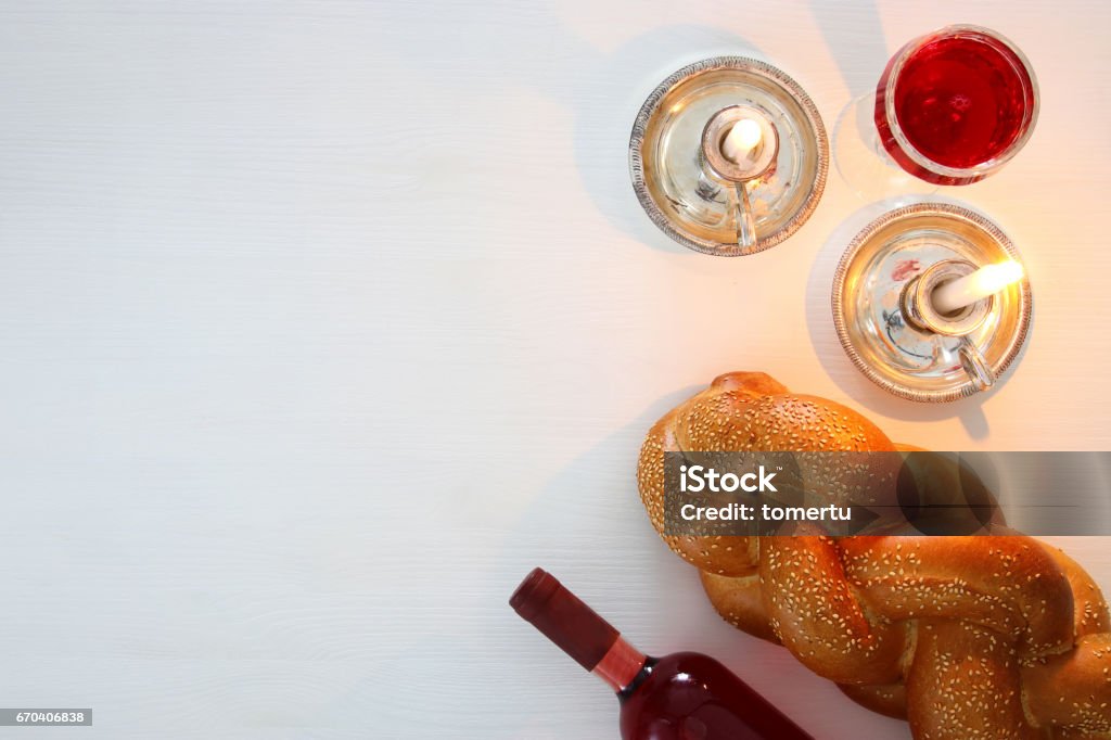 shabbat image. challah bread, shabbat wine and candles shabbat image. challah bread, shabbat wine and candles. Top view Jewish Sabbath Stock Photo