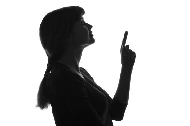 istock silhouette profile of a woman on isolated background 670407032