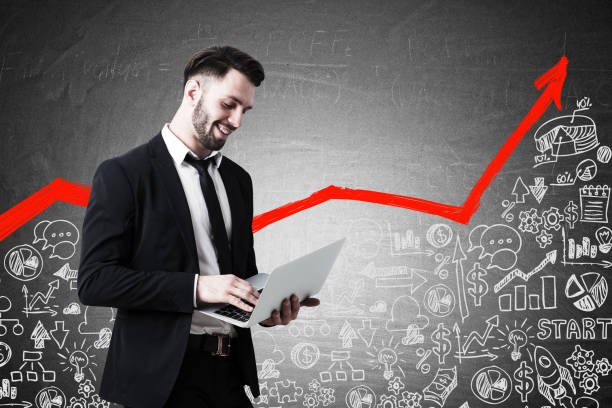 istock Man with laptop and red graph with icons 670407488