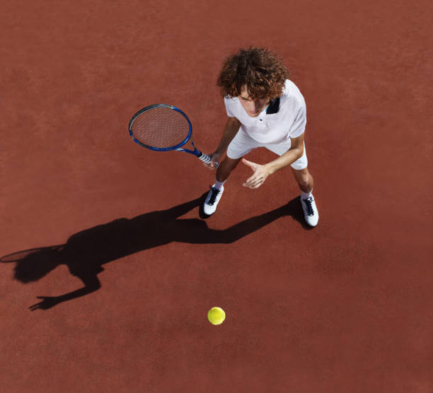 istock tennis player with racket during a match game 670407696