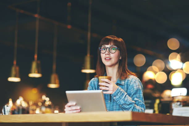 istock Enjoying her double dose of coffee and connectivity 670410742