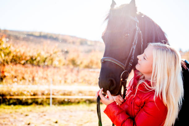 istock Woman Devoted To Her Horse 670411636
