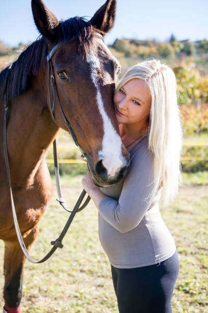 istock Confidence Between Horse And Woman 670411728