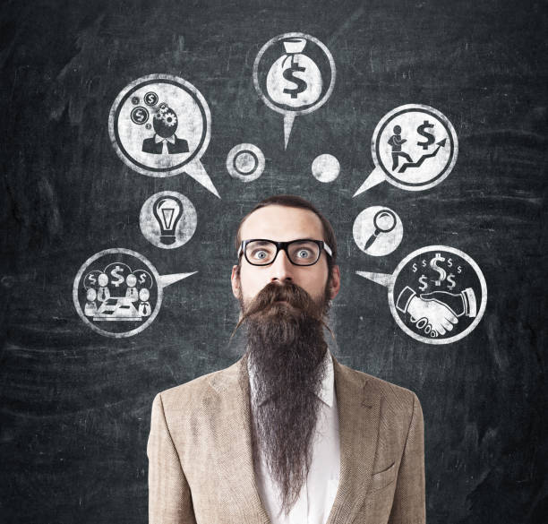 istock Man with long beard and money icons 670411810