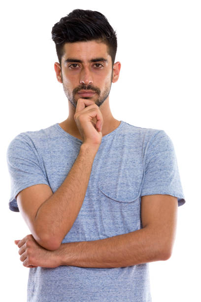 istock Studio shot of young Persian man thinking 670412024