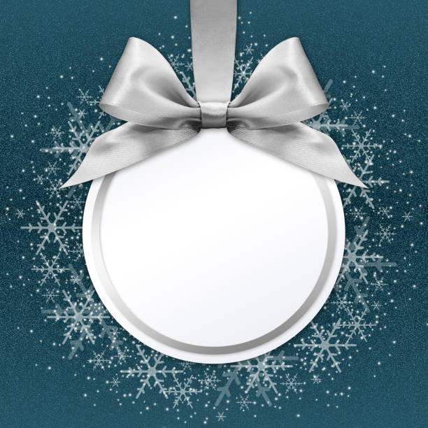istock christmas ball with silver satin ribbon bow on blue background 670414470
