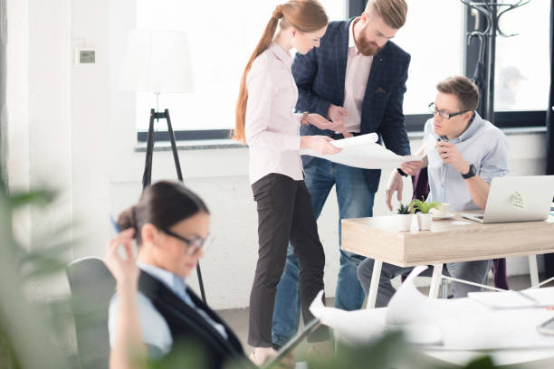 istock Young businesspeople working together 670414592