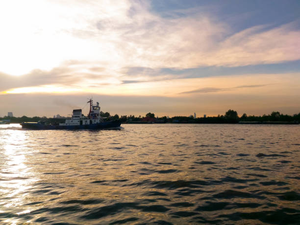 istock Tugboat on the river in evening 670414658
