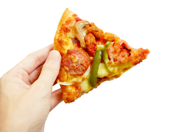 istock Hand picking a piece of pizza 670414662