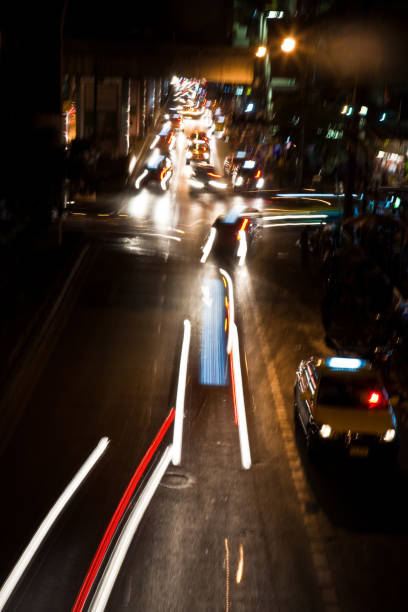 istock light beam at night from cars at the main road 670415082