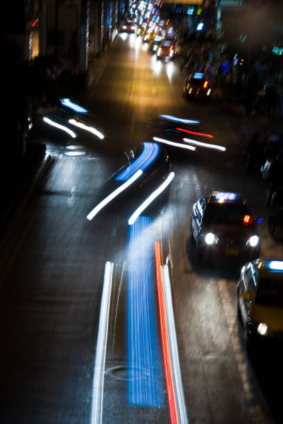 istock light beam at night from cars at the main road 670415426