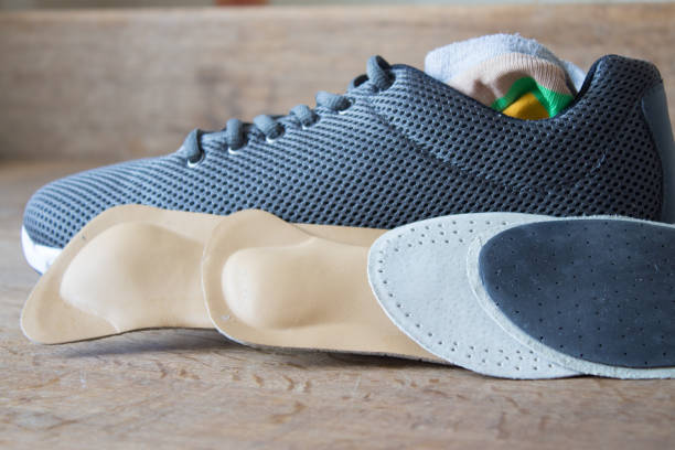 istock Gray running shoes with orthopedic insoles 670418428