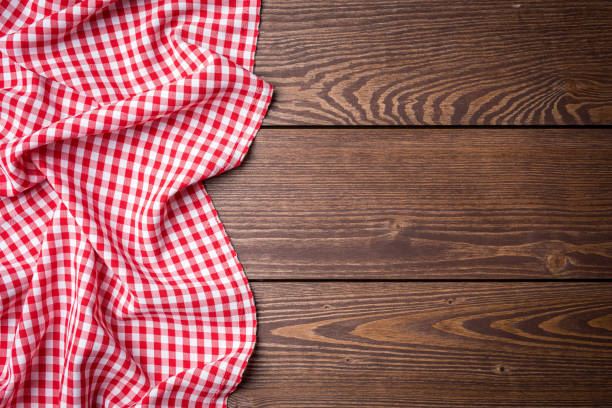 istock Overhead shot of red tablecloth on an old wooden table 670421308