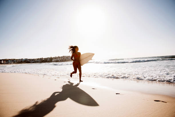 istock Fit surfer girl running 670422606