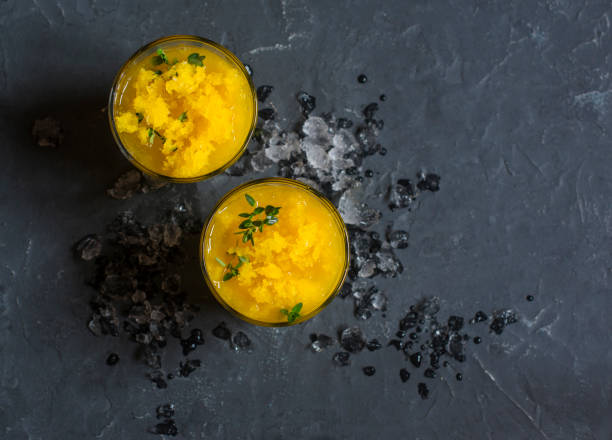 Turmeric mango  cold nectar on a dark background, top view