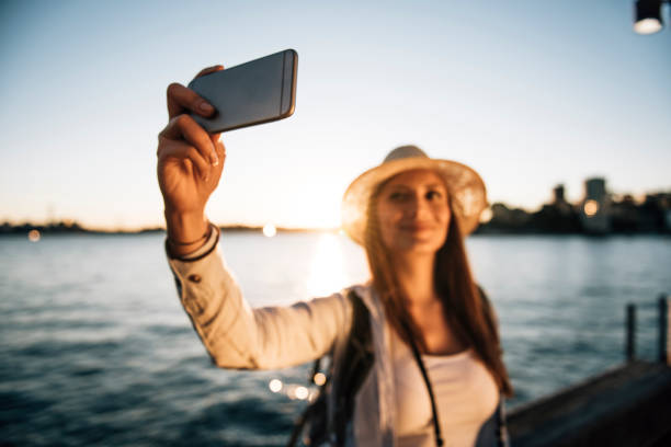 istock Girl with a hat making a selfie 670424750