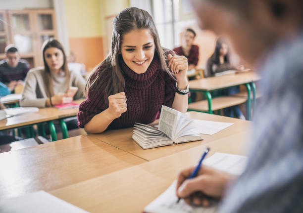 istock Excited student anticipating an evaluation grade in the classroom. 670425352