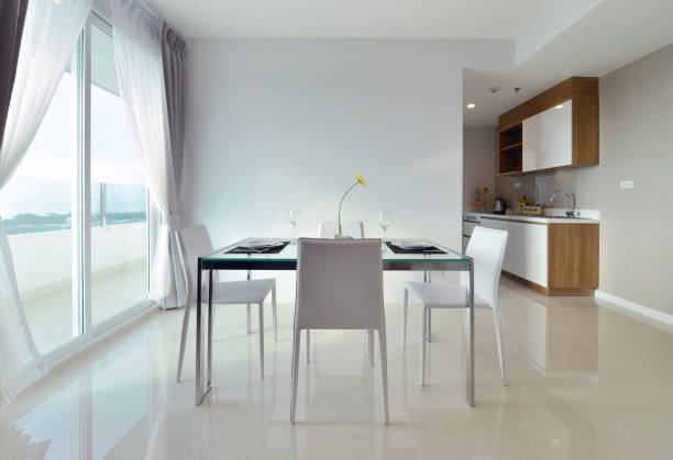 istock dining table with table set in white luxury modern living interior and decoration, interior design 670429616