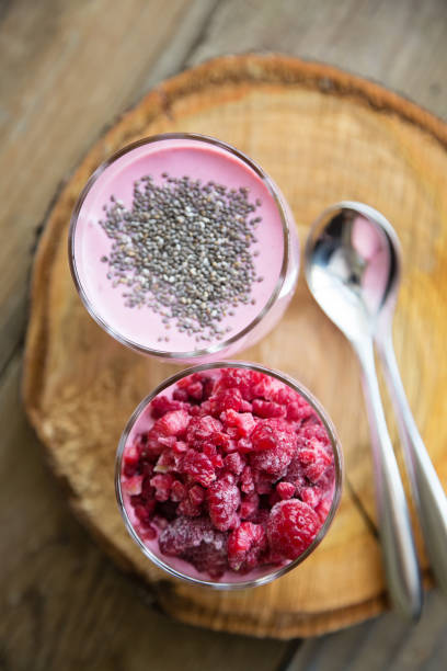 istock Chia raspberies cottage cheese breakfast in two small transparent glasses 670430266