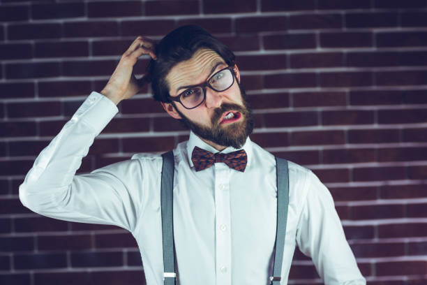 istock Portrait of man scratching head 670432642