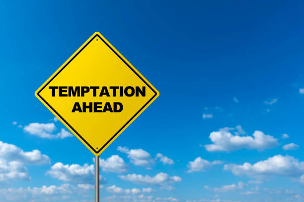 istock Temptation Ahead  - Road Warning Sign 670433964