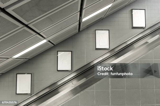 Four Big Vertical Portrait Orientation Blank Billboard With Escalator Background Stock Photo - Download Image Now