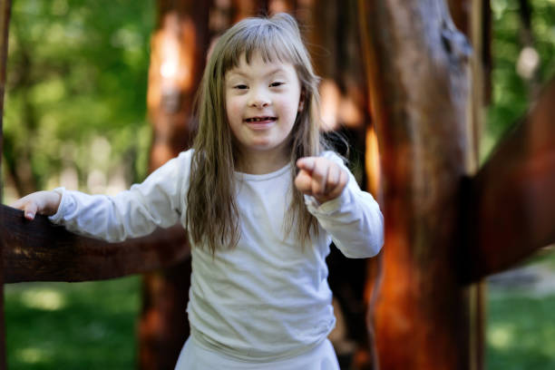istock People with down sydrome are equally happy, walking in nature 670435810