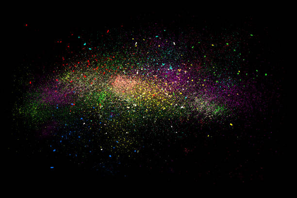 istock Freeze motion of colorful powder exploding isolated on black, 670441174