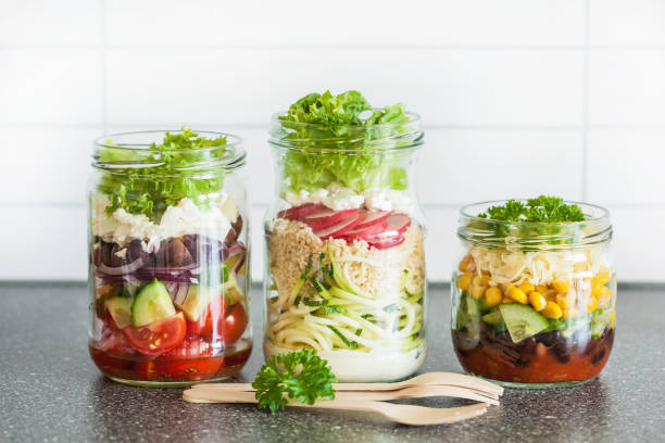 healthy vegetable cheese salad in mason jars healthy vegetable cheese salad in mason jars onion layer stock pictures, royalty-free photos & images