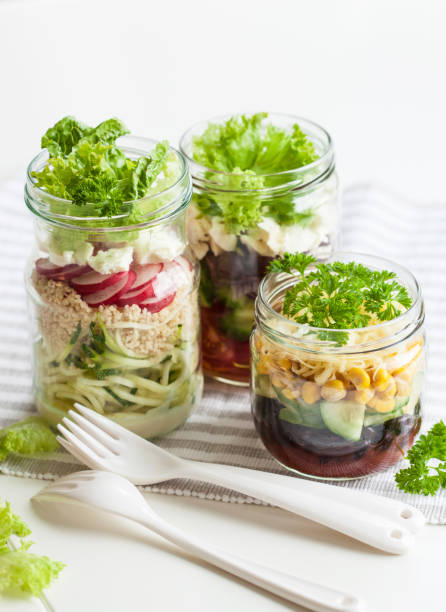 istock healthy vegetable cheese salad in mason jars 670441608