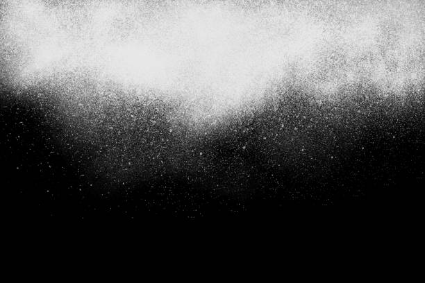 Freeze motion of  white powder exploding, isolated on black, Freeze motion of white powder falling, isolated on black, dark background. Abstract design of white dust cloud. Particles explosion screen saver, wallpaper with copy space. Planet creation concept photoshop texture stock pictures, royalty-free photos & images