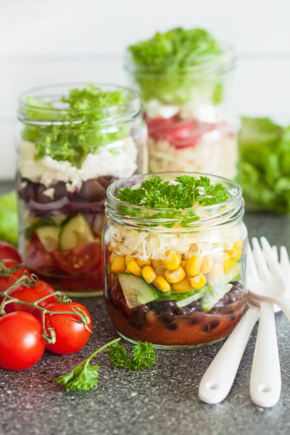 istock healthy vegetable cheese salad in mason jars 670441806