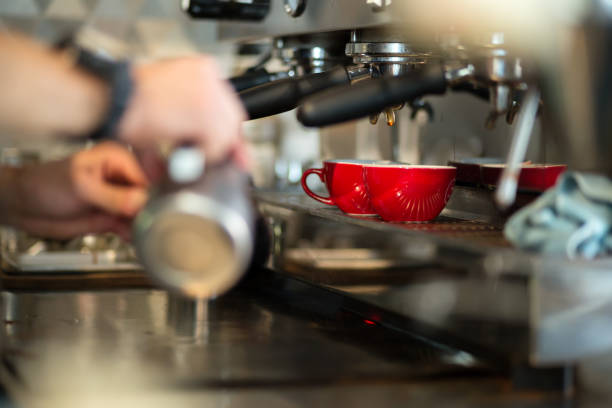 istock Professional barista making fresh coffee with machine 670442744