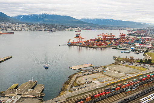 Vancouver, Canada - January 28, 2017: Vancouver Port with hundreds of shipping containers and mountains in the background