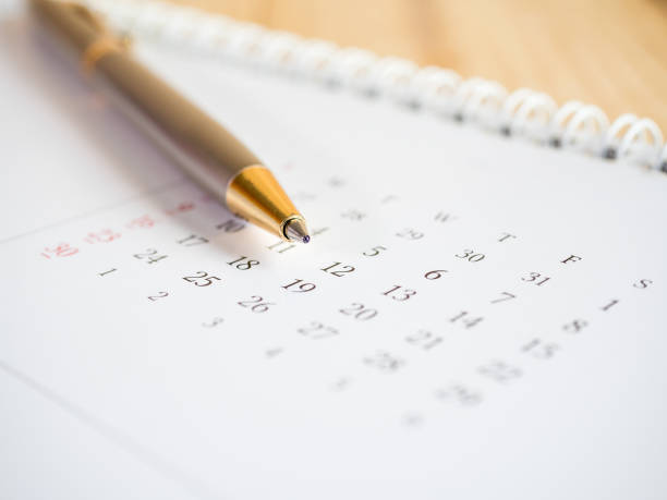 istock Pen put on calendar desk 3 670443360