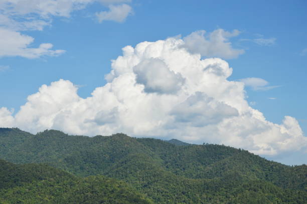 istock cloudy behind mountain in sunny day 670443538