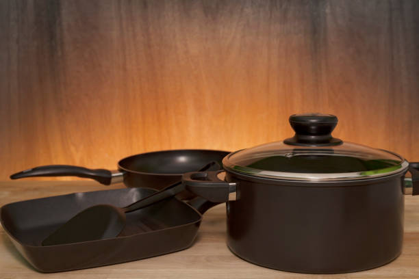 istock kitchenware, cookware set on wood table ,wooden and light background. 670447804