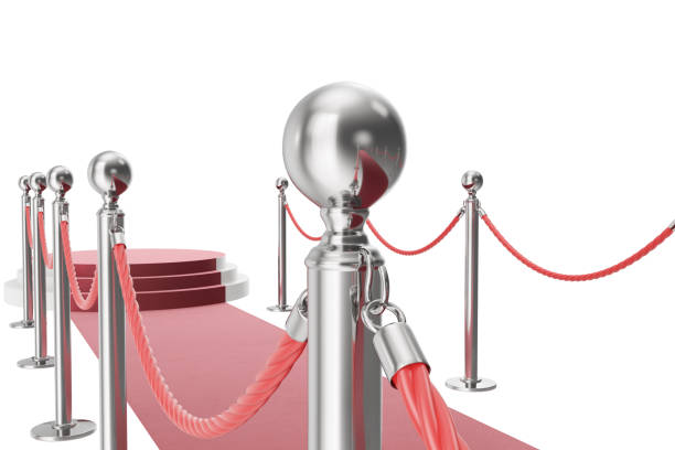 istock Red carpet isolated on white background. 3d rendering of silver stanchions and ropes between them 670447878